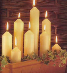 church candles alight in pot