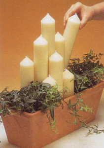 placing church candles in pot